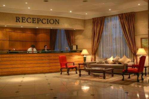 a lobby of a hotel with a reception desk at Hotel Costa Real in La Serena
