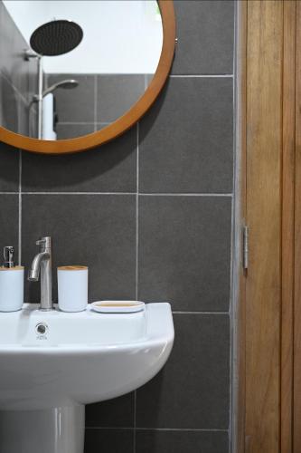 a bathroom with a sink and a mirror at Bao Village in Haad Yao