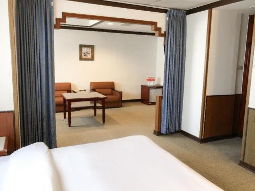 Guide Hotel Changhua Jhongjhengにあるベッド