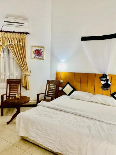 Katil atau katil-katil dalam bilik di Hikka Paradise Guest House