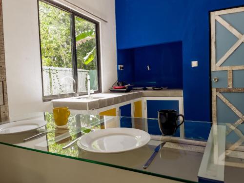 a bathroom with two sinks and a window at Lost & Found Hostel Weligama in Weligama