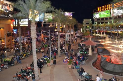 a group of motorcycles parked in a street at night at 4 Bedroom Home-Casino-State Farm Stadium only 2 Miles in Glendale