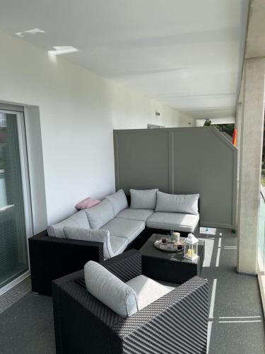 a living room with a couch and a table at Ferienhof Elbaue in Schönebeck