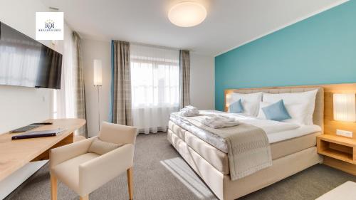 Postel nebo postele na pokoji v ubytování R&R Residenzen Aparthotel