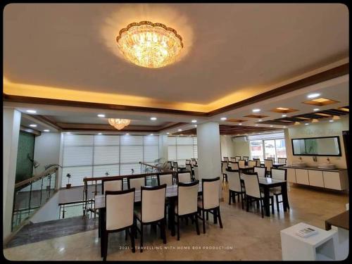 a large banquet hall with a table and chairs at The Castle Inn in Dhaka
