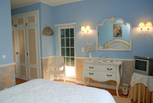 Postel nebo postele na pokoji v ubytování Casal Santo Antonio