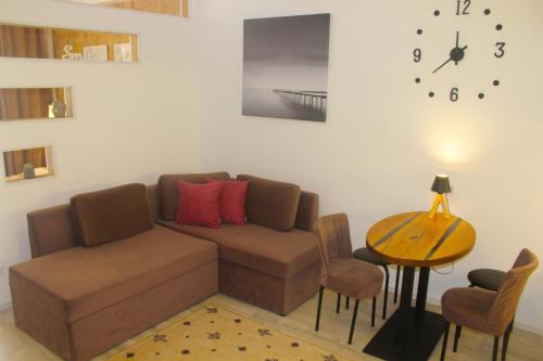 a living room with a couch and a table at Sweet Home in Kyiv
