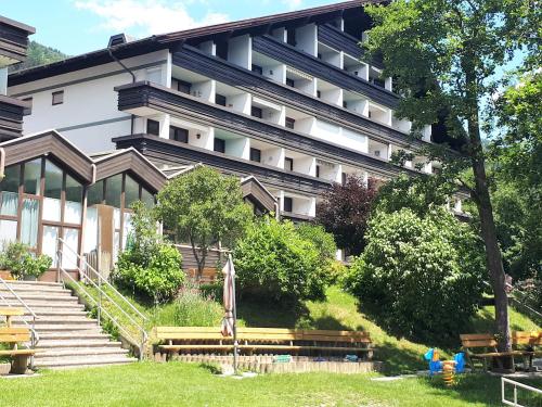 a building with a park in front of it at ADRIAN Seeblick Appartement Hänsel u Gretel am Ossiacher See mit direktem Seezugang, Hallenbad in Steindorf am Ossiacher See