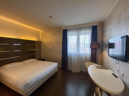 Postel nebo postele na pokoji v ubytování CAVALLO Hotel Noventa di Piave