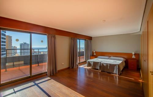 Katil atau katil-katil dalam bilik di Apartamentos Michel Angelo Benidorm