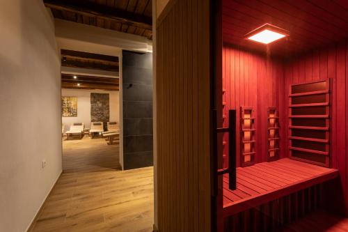 a room with a red wall and a red door at Guest House Valentincic in Nova Gorica