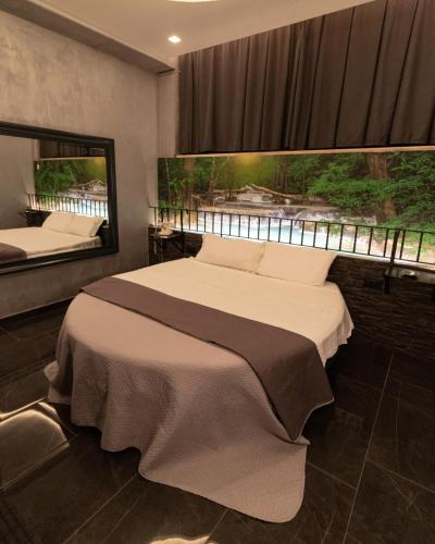 Ένα ή περισσότερα κρεβάτια σε δωμάτιο στο Meeting Hotel