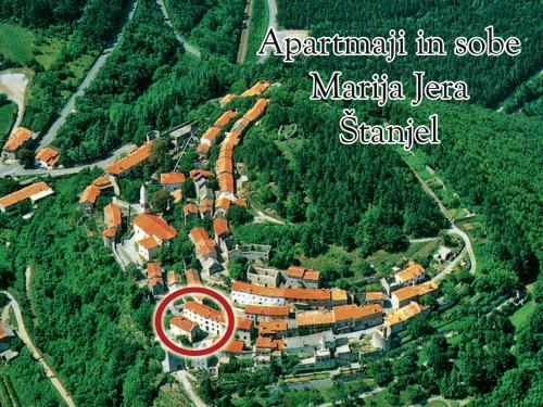 an aerial view of a village with a red circle at Apartmaji in sobe Marija Jera Štanjel in Štanjel