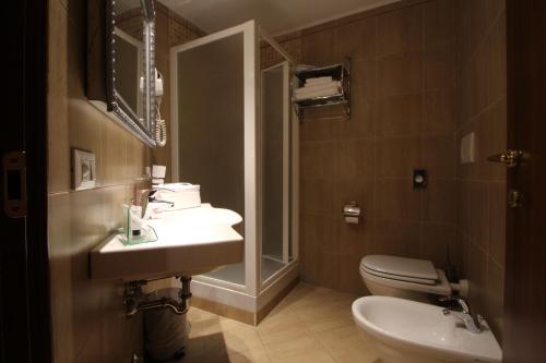 a bathroom with a sink and a toilet at Locanda Navona in Rome