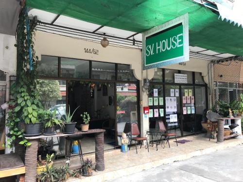 a sushi house with tables and chairs in front of it at SV. HOUSE in Jomtien Beach