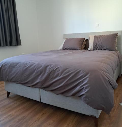 Postel nebo postele na pokoji v ubytování ICEBUILD APARTMENTS