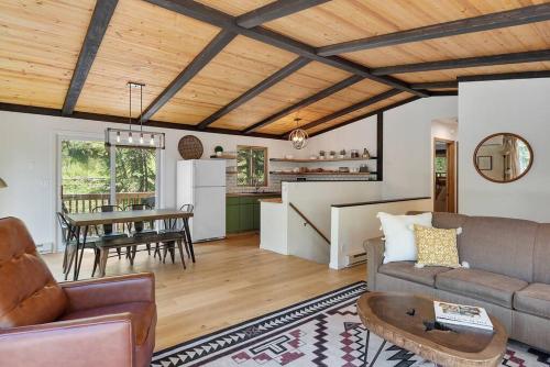 a living room with a couch and a table at Nature Stay with Views Like No Where Else in Custer