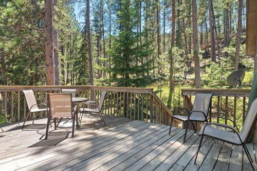 a wooden deck with chairs and a table on it at Nature Stay with Views Like No Where Else in Custer