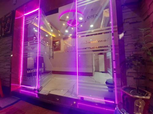 a room with pink lights on the front of a building at HOTEL SANDSTONE INTERNATIONAL in Kolkata