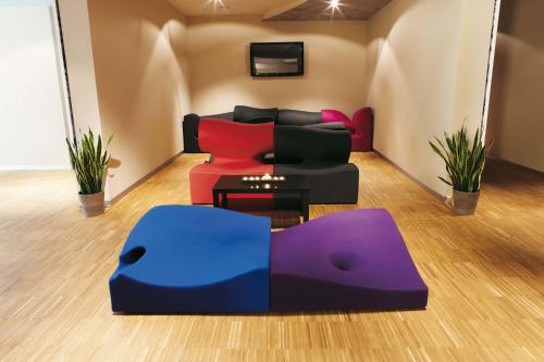a living room with a couch and a table at Hotel Aqua in Abano Terme