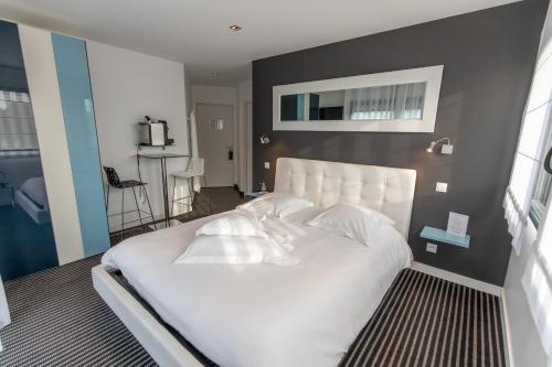 En eller flere senge i et værelse på Chambres d'Hôtes de l'Avel Vor