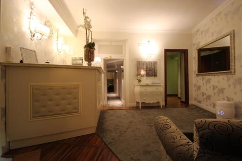 a living room with a couch and a table at Locanda Navona in Rome
