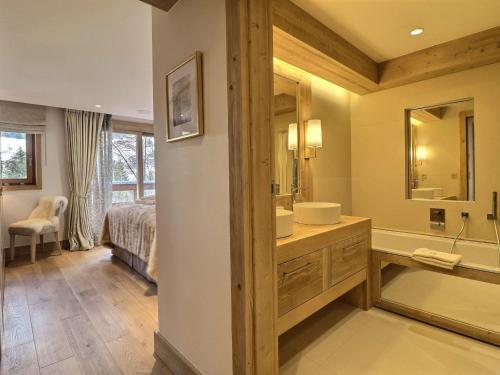 a bathroom with a sink and a mirror at Chalet Morzine, 7 pièces, 12 personnes - FR-1-627-20 in Morzine