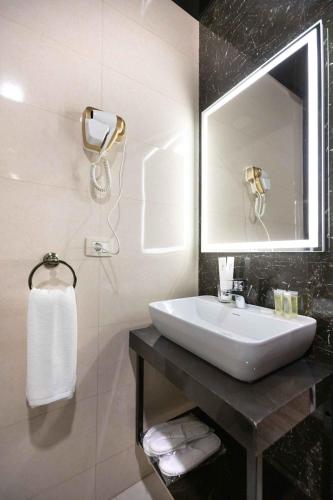a bathroom with a sink and a mirror at Alaska Resort in Tsaghkadzor