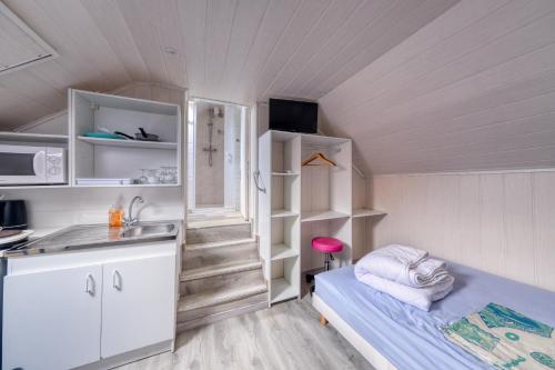 Postel nebo postele na pokoji v ubytování Logements ouvriers à la campagne