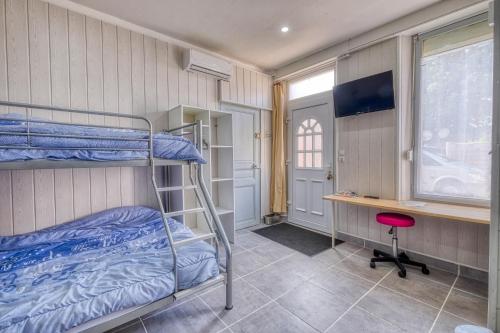Postel nebo postele na pokoji v ubytování Logements ouvriers à la campagne