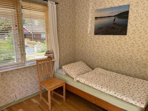 Ένα ή περισσότερα κρεβάτια σε δωμάτιο στο typical Swedish cosy holiday house in Målilla, Småland
