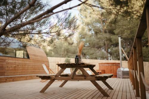 a picnic table with a vase on it on a patio at Welmoon Villas Paisaje in Caravaca de la Cruz