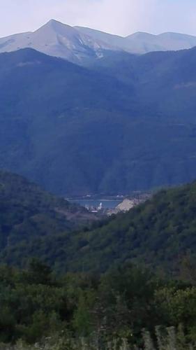 a view of a valley with a mountain in the distance at Wooden House Ashuri in Veltaurtkari