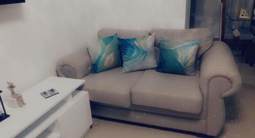 a couch with pillows on it in a living room at Residencial Santa Rosa Apto 8 Section C in Moca