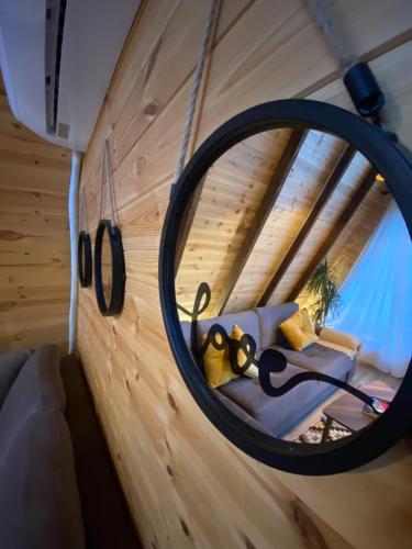a convex mirror in a tiny house at Agora Farmhouse in Koman