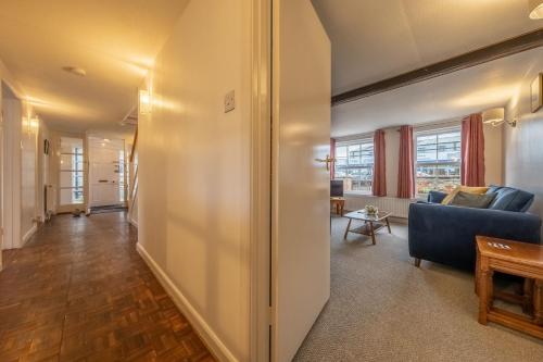 a living room with a couch and a table at The Town House in Woodbridge