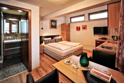 Ένα ή περισσότερα κρεβάτια σε δωμάτιο στο Appartements & Chalets Wiesenruh