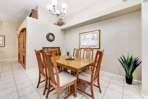 a dining room with a wooden table and chairs at Hillview Haven in Mesa