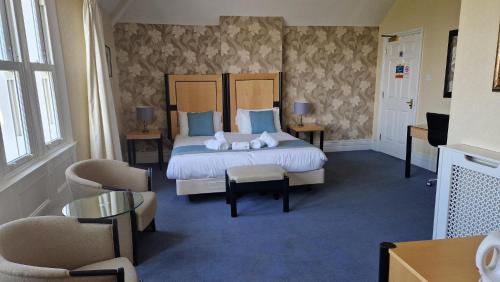 a hotel room with a bed with two mice on it at The Beach Weston in Weston-super-Mare
