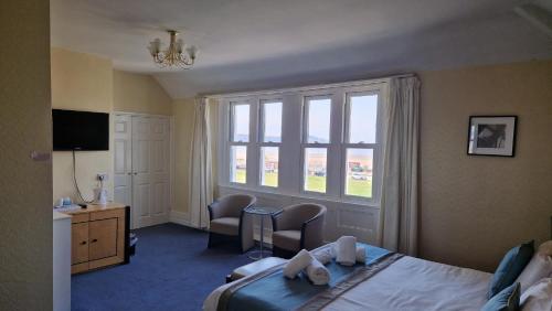 a hotel room with a bed and a window at The Beach Weston in Weston-super-Mare
