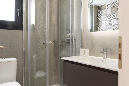 a bathroom with a sink and a shower at Voda Luxury Residence #402 in Athens