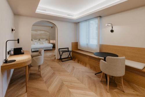 Postel nebo postele na pokoji v ubytování Hotel Petit Luxe