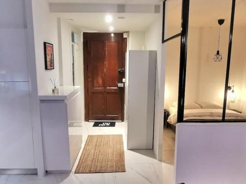 a room with a door leading to a bedroom at P&R1, one bedroom, city center Geneva in Geneva