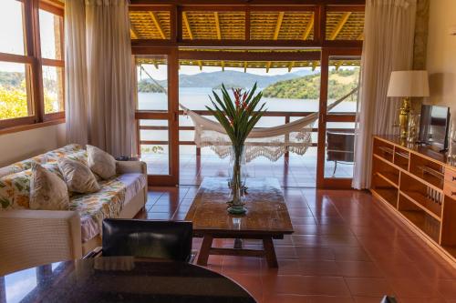 a living room with a couch and a table at Santa Clara Hotel in Paraty