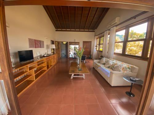 a living room with a couch and a table at Santa Clara Hotel in Paraty