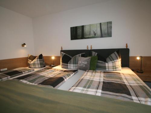 two beds sitting next to each other in a bedroom at Apartment Neurauter-1 by Interhome in Fügen