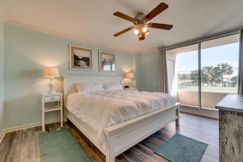 a bedroom with a bed and a ceiling fan at Amazing Waterview Towers 104 Condo With Boat Slip in Destin