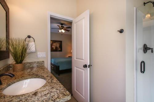 a bathroom with a sink and a mirror at Amazing 4 Bedroom Vacation Home in The Villages of Crystal Lakes in Destin