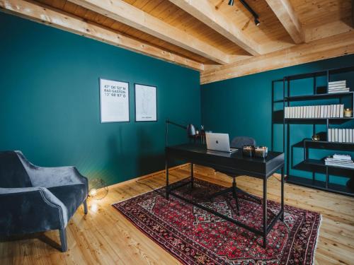 a room with a desk and a chair at Chalet Chalet 1018 by Interhome in Bad Gastein