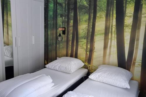 Postel nebo postele na pokoji v ubytování Gezellige, luxe bungalow 't pareltje in het bos in Hardenberg "Rheezerveen"woning 20